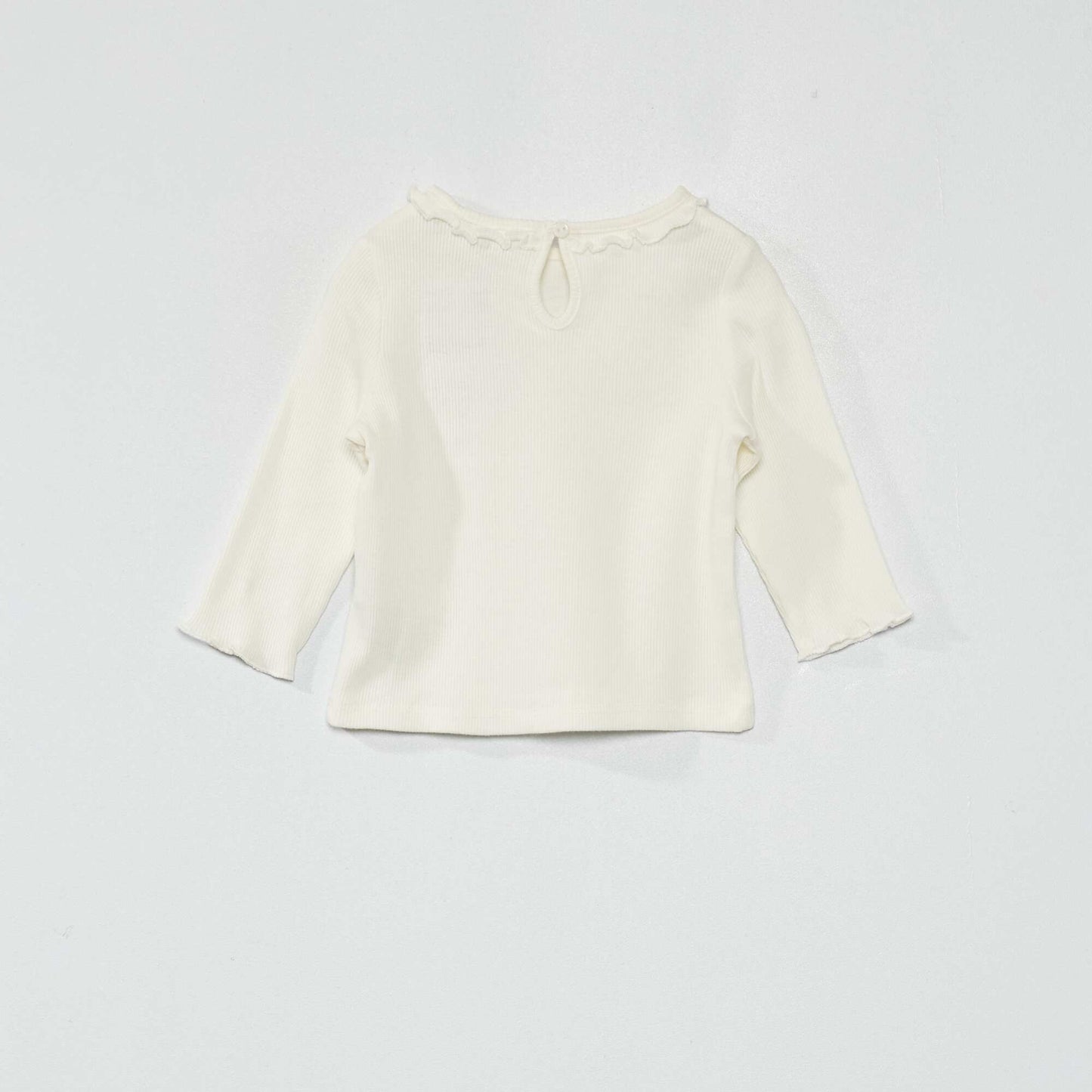 T-shirt en maille c tel e col volant blanc