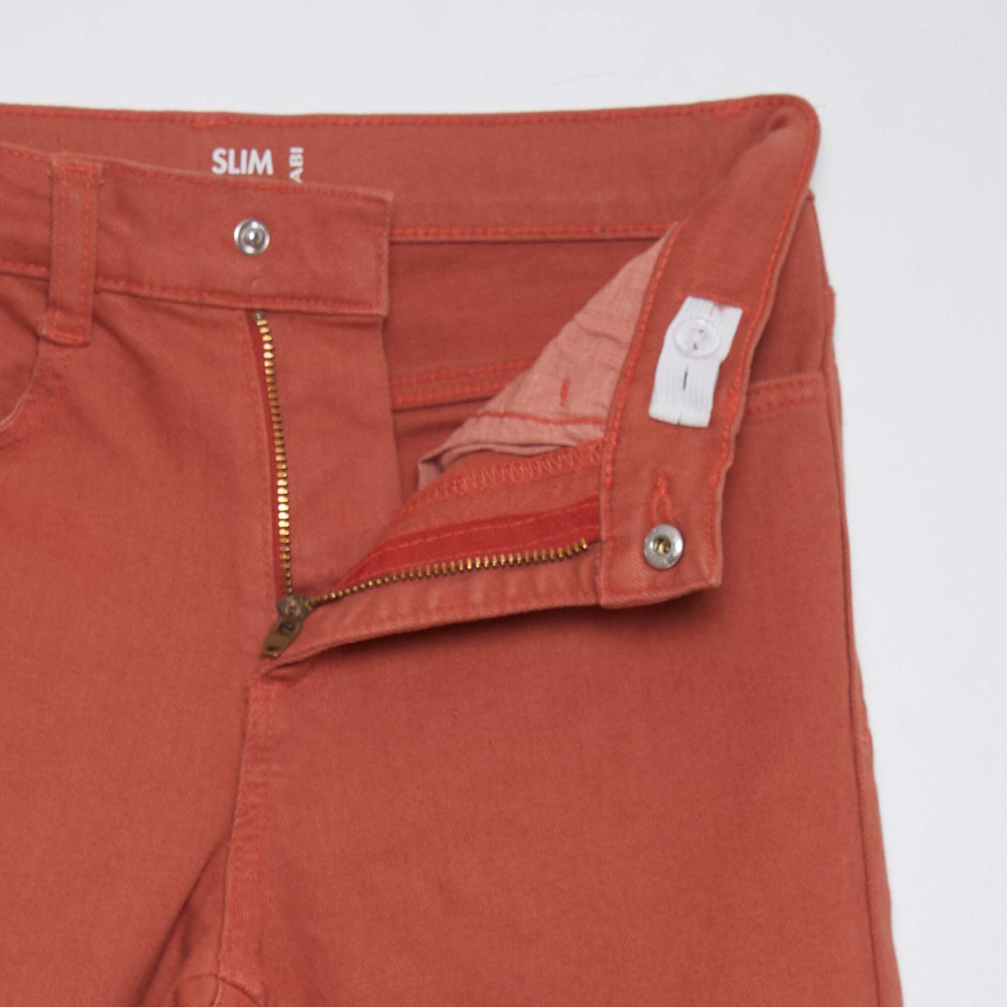 Jean slim 5 poches rouge brique