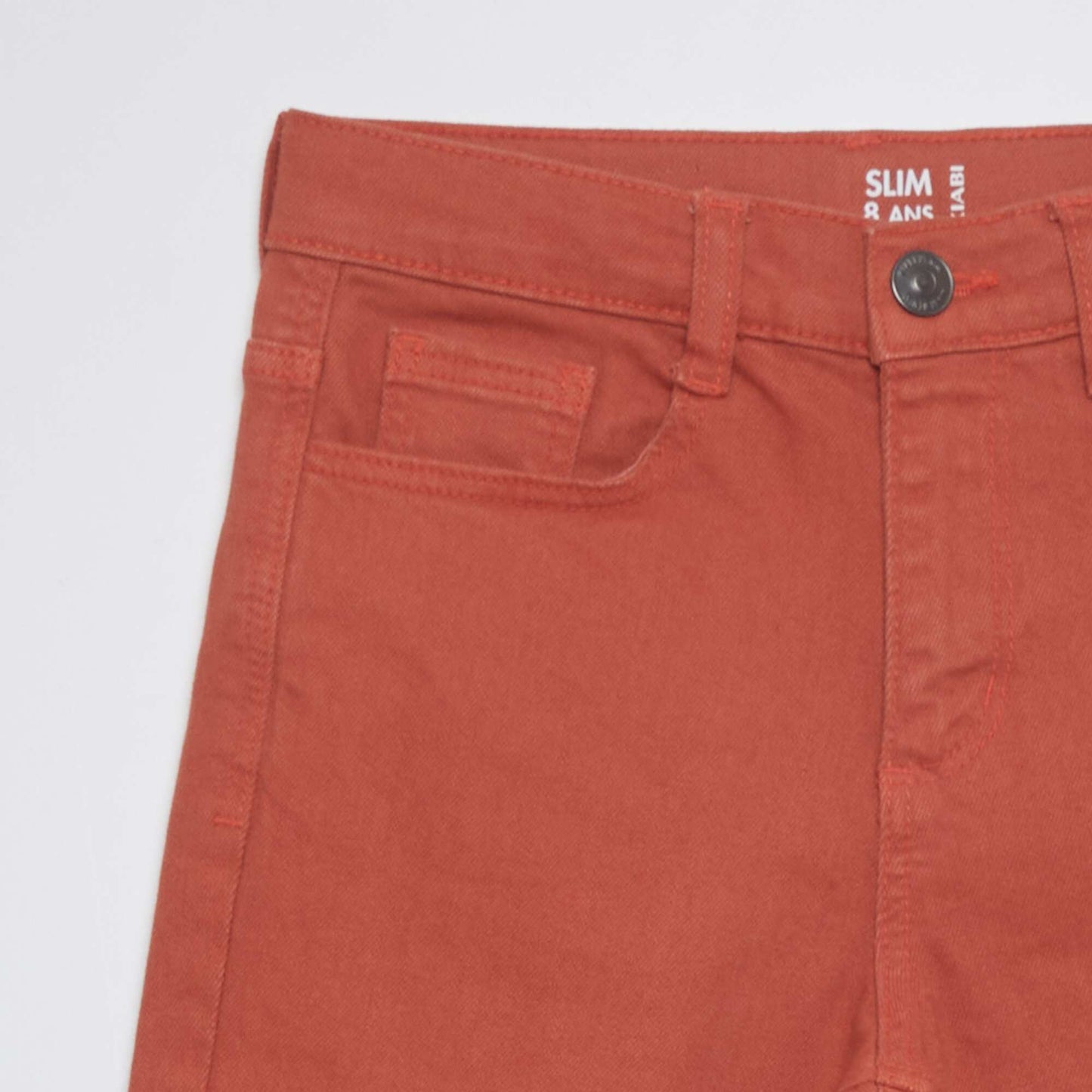 Jean slim 5 poches rouge brique