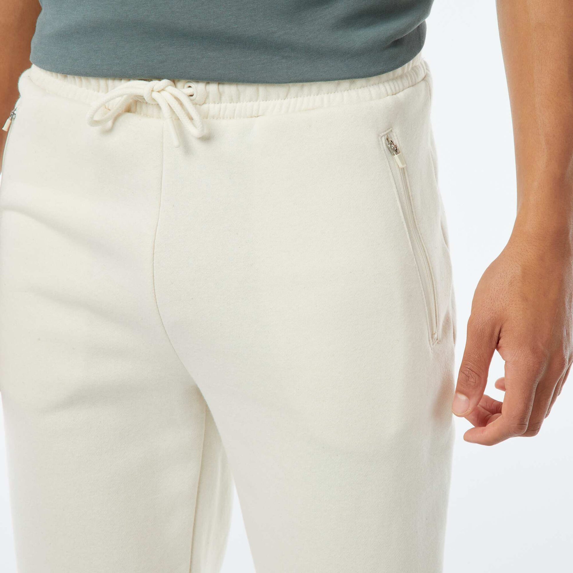 Jogging en molleton gratté avec 2 poches zippées BLANC CASSé