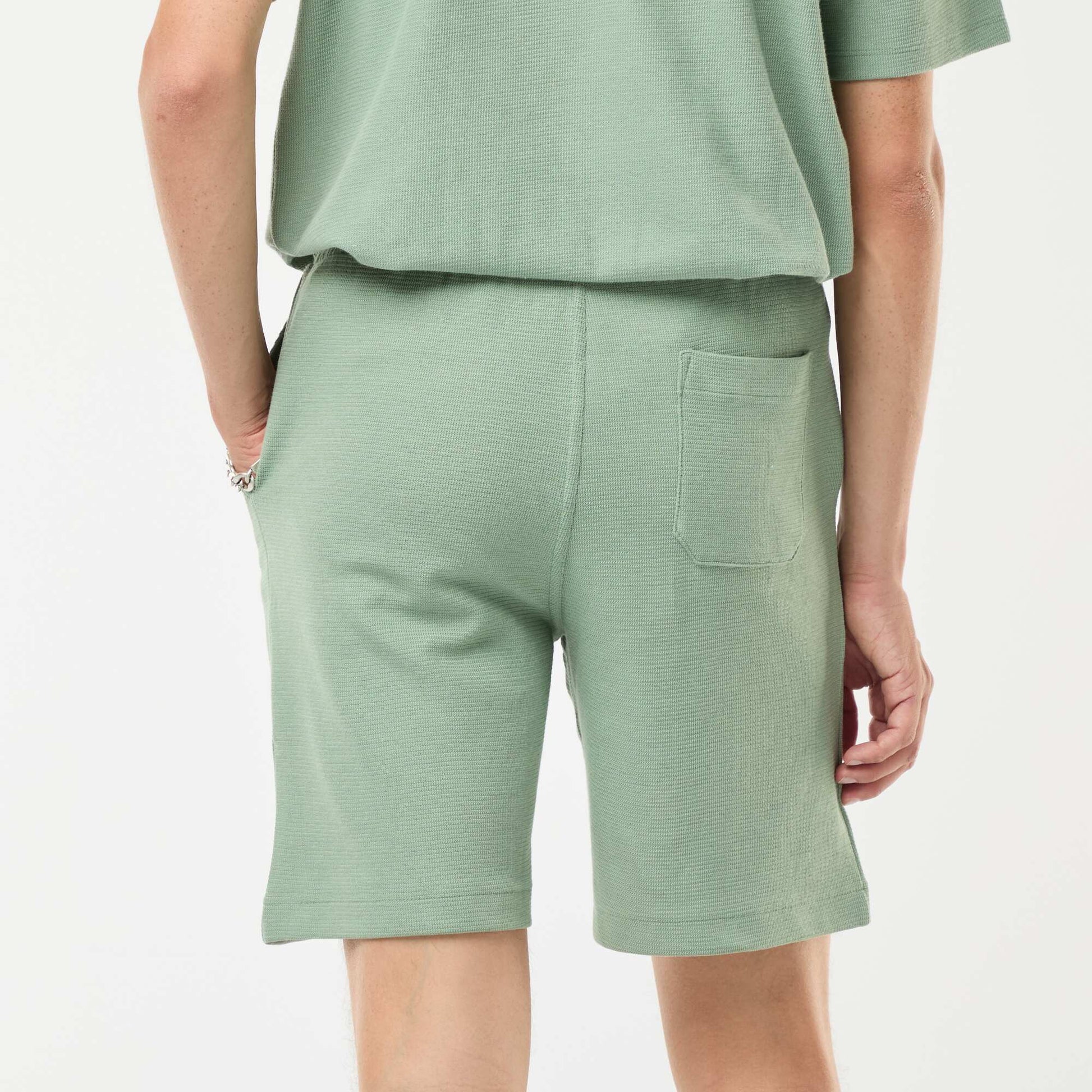 Short de sport avec poches en maille fantaisie VERT