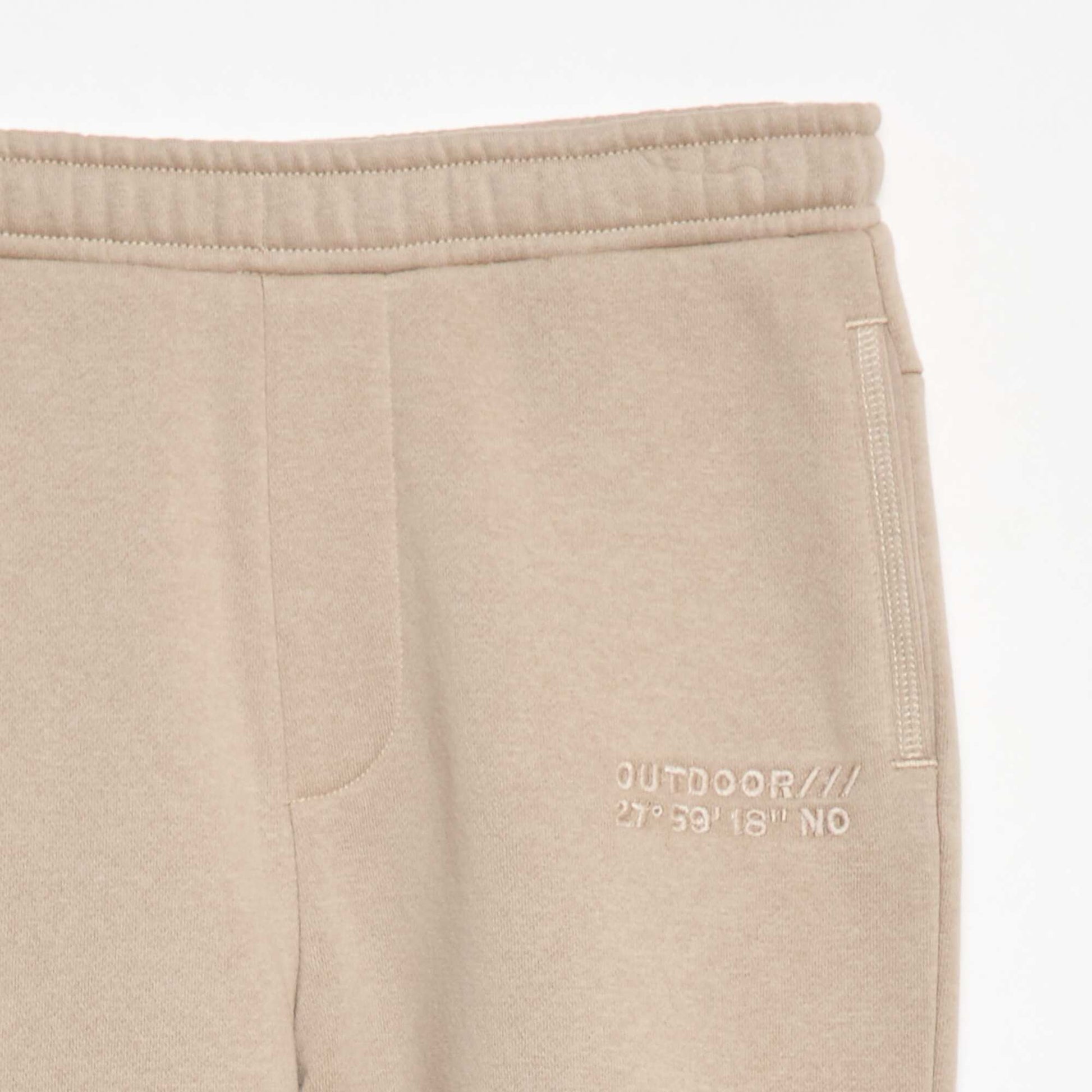 Pantalon jogging avec inscription brodée BEIGE