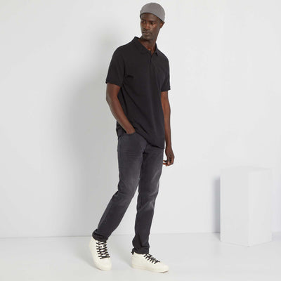 Polo uni en piqu de coton noir